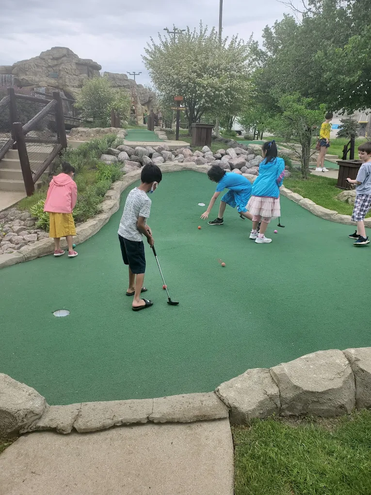 Kids putting on the course